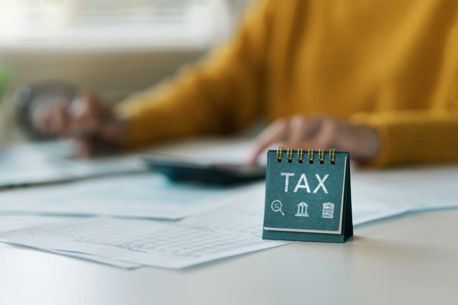 Provisional tax South Africa calculation with TAX desk calendar and financial documents